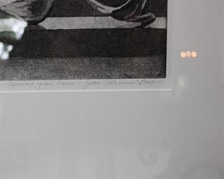 Signature on framed print of a sprouted yellow onion