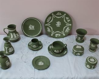 Large selection of green and white Wedgwood jasperware including plates, cups and saucers, covered boxes, pitcher, and vases