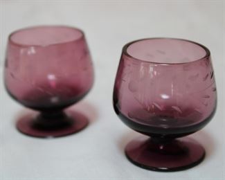 Small footed cordial glasses in etched amethyst glass