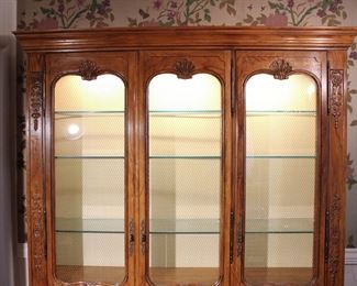 Top view of the large Baker Furniture Company hand carved French Provincial style lighted display cabinet in like new condition