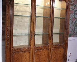 Large Baker Furniture Company hand carved French Provincial style lighted display cabinet in like new condition