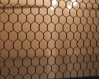 Detail of "chicken wire" on the glass doors of the large Baker Furniture Company hand carved French Provincial style lighted display cabinet in like new condition