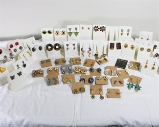 Many pair of earrings including clip ons, pierced, sterling silver, and Native American Zuni inlay earrings