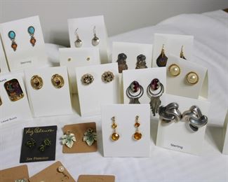 Close up of earrings, note the Native American Zuni inlay earrings in the right center.