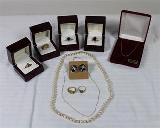 Group of fine jewelry including an 18K yellow gold with diamonds snake form ring, a black star sapphire and diamond ring, a 9K yellow gold Claddagh ring from Ireland, a large pink tourmaline and diamond ring, 14K white gold, onyx, and diamond earrings, 14K ring with mesh top, and cultured pearls with a 14K clasp 