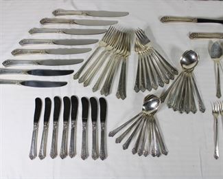 Close ups of the service for 8 in Oneida's Damask Rose sterling silver pattern, with serving pieces