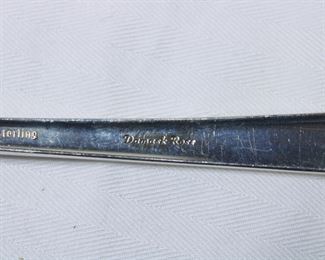 Pattern name on the Service for 8 in Oneida's Damask Rose sterling silver pattern, with serving pieces