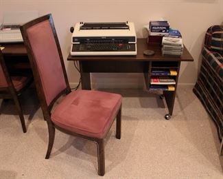 Wonderful typing desk with open cubicles for papers, on casters.