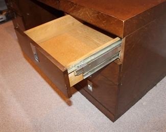 Drawer slides on the FABULOUS 1970's or early 1980's Executive Style Desk in burlwood with campaign style handles