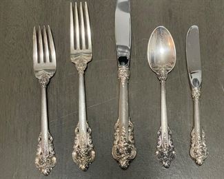 One place setting of the Wallace Grand Baroque sterling silver flatware set, five piece place settings, service for 12, plus 7 serving pieces