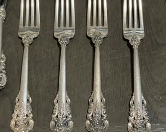 Detail of the Wallace Grand Baroque sterling silver flatware set, five piece place settings, service for 12, plus 7 serving pieces