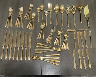 c. 1960's service for eight of Duralite gold colored silverware purchased at Krautheim's Jewelers in Muskegon