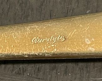 Mark on the c. 1960's service for eight of Duralite gold colored silverware purchased at Krautheim's Jewelers in Muskegon