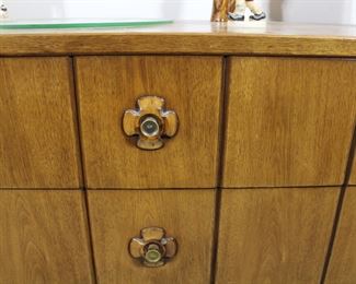 Detail of the drawer pulls on the mid century Drexel dressers