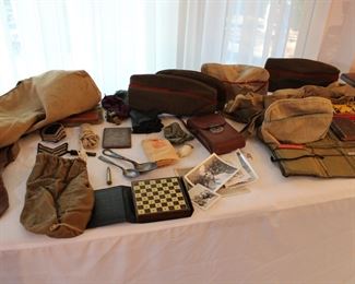 One soldier's Army Kit and uniform parts including sox, ties, hats, games, sewing kit, whistle, shaving instructions, shaving mirror, etc. 