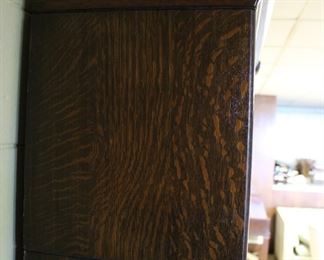 Close up of grain and finish on the five matching original finish five stack oak barrister bookcases