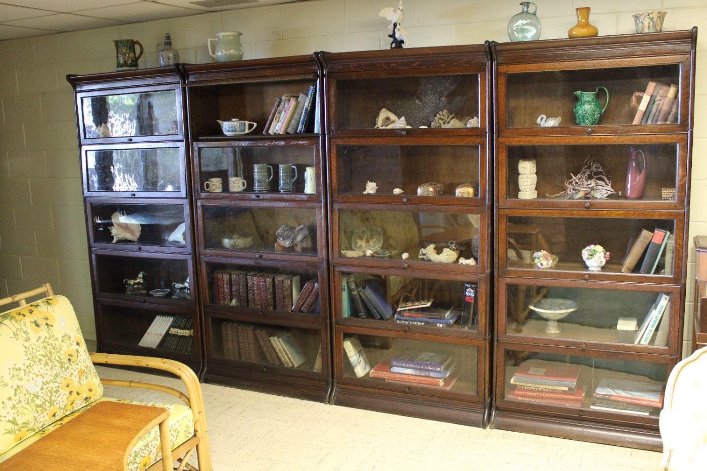 Four of the five matching original finish five stack oak barrister bookcases