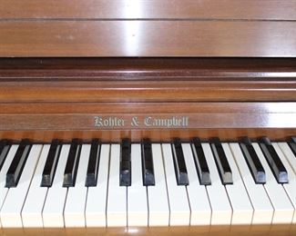 Another view of the Kohler & Campbell upright piano with piano bench