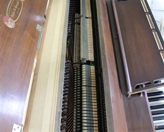 Another view of the Kohler & Campbell upright piano with piano bench