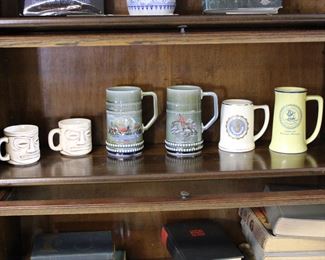 1970's Tiki mugs, Irish porcelain steins, University of Michigan stein, and Independent Order of Vikings, Linne #57, Muskegon, Michigan stein