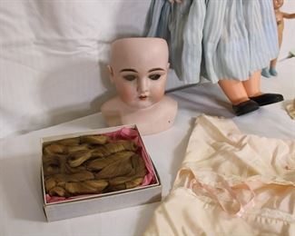 German bisque doll head with curls/hair