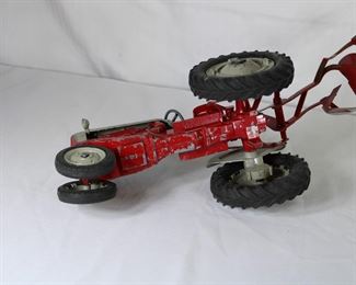 Underside view of the Hubley Ford 961 Powermaster Tractor with plow