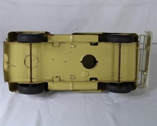 Underside view of the Buddy L vintage yellow pressed steel pick up truck
