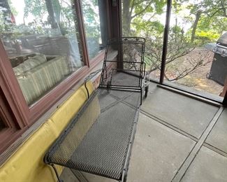 Wrought iron chaise lounge with its original yellow cushion