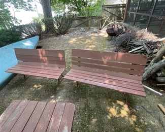 Old park bench style benches with iron legs