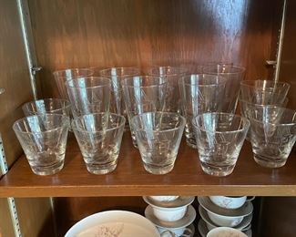 Fabulous mid century modern high ball glasses and on the rocks glasses with a Deco Style etching with antelope