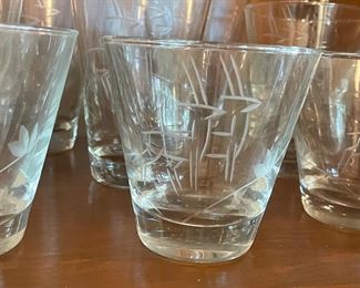 Detail on the fabulous mid century modern high ball glasses and on the rocks glasses with a Deco Style etching with antelope