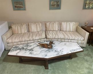 Gorgeous down filled mid century sofa that has been recovered in a neutral tiger stripe fabric, 9 feet long, shown with the stunning Italian marble top cocktail table, 6' long, 32" at its widest point, 16" tall.  Elongated diamond shape to fit with V shaped sofa