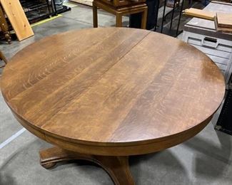 Browns double extension round dining table with two leaves 48in round by 29 in high with two leaves one is 11.5 and the other is 9.5 inches
