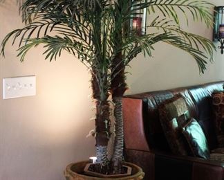 Faux palm tree and clay pot.
