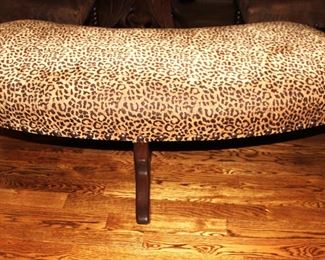 Curved leopard print bench.