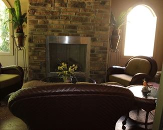 Lovely set of wicker furniture includes love seat, two chairs, coffee and end table.  