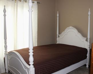 Superb full size white poster bed with mattress and box spring.