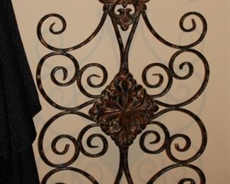 Decorative iron, scrolled wall hanging.