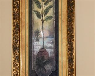 Palm art in ornate gold frame.