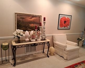 NICE TABLE WITH GLASS TOP AND IRON TRIM AND LEGS, FRAMED ART, FIGURINES, CANDLE HOLDERS