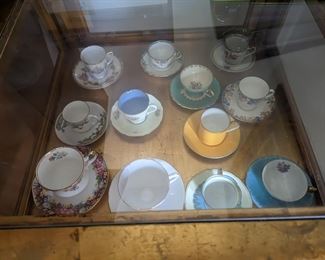 tea cup collection.  Glass table also for sale
