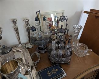 Several cruet sets for condiments and sterling silver pair of candlesticks