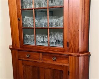 This walnut corner cupboard from 1810, was purchased in Gettysburg from an antique dealer in the 60's.  Waterford Crystal inside.