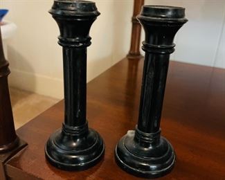 Ebony antique candlesticks.