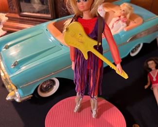 PJ doll on stand by Mattel 