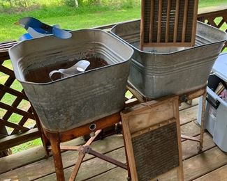 Single Metal washtubs each on stand 