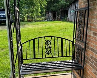 Iron bench incased in archway 