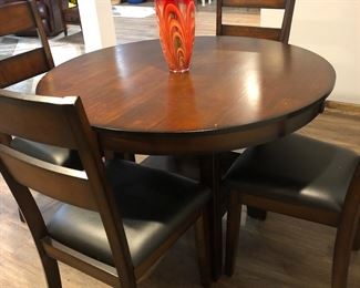 Two dining tables and chairs sets