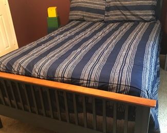 Dark blue with wood trim bed