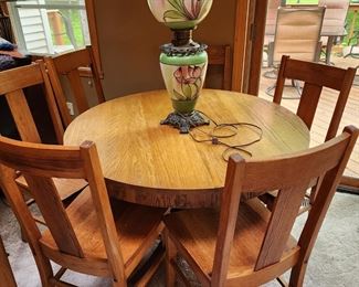 Oak round table and 6 chairs. 